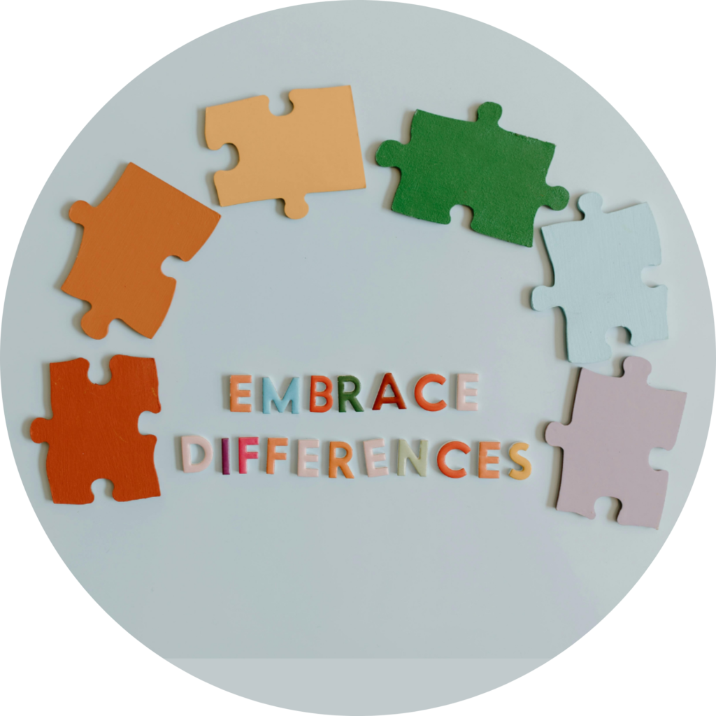 Rainbow colored puzzle pieces with letters spelling "Embrace Differences"